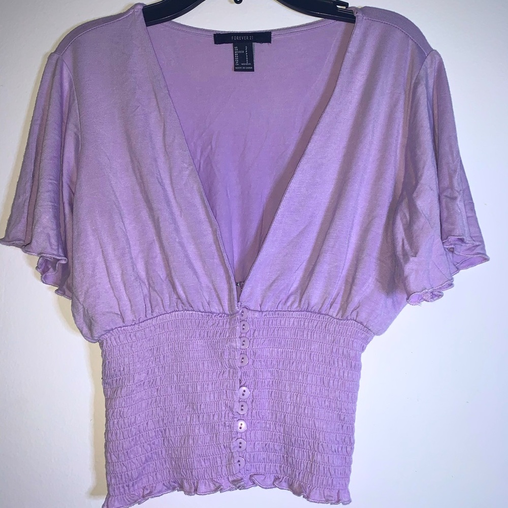 Low v neck lilac blouse with buttons half way up
